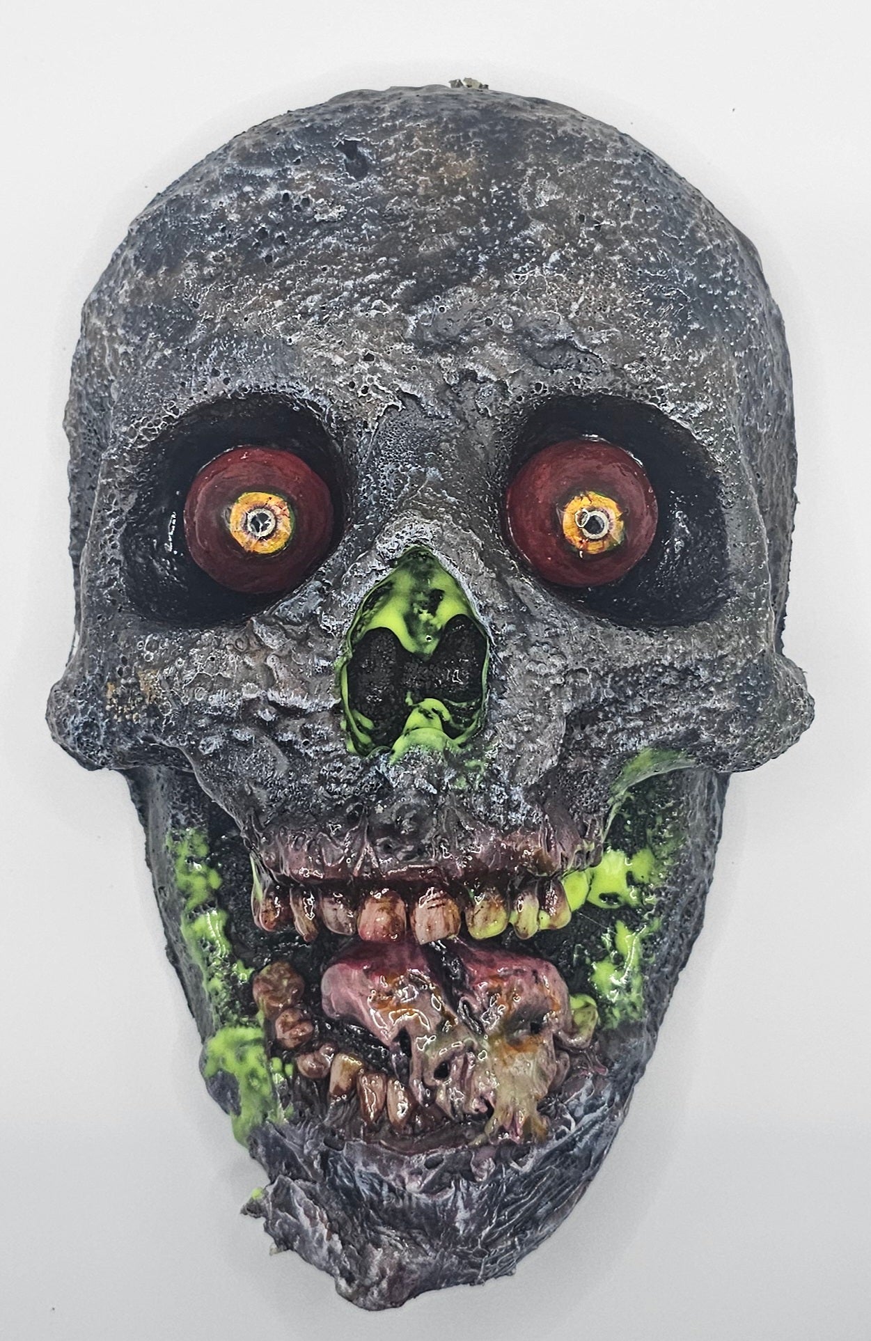 Decorative skull with glowing eyes on a white background