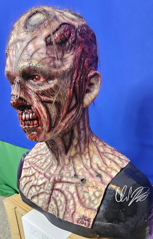 The Walking Dead inspired walker bust signed by 2 actors.