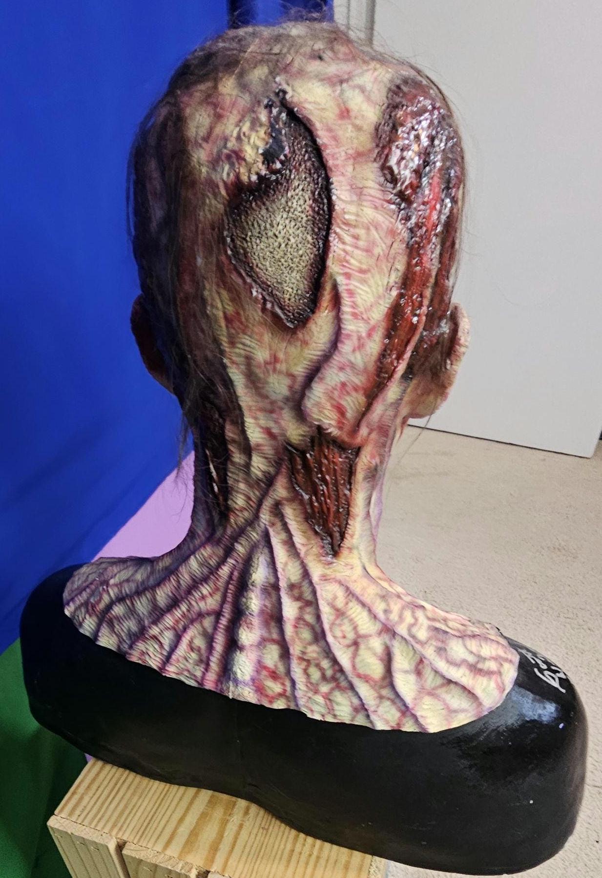 The Walking Dead inspired walker bust signed by 2 actors.